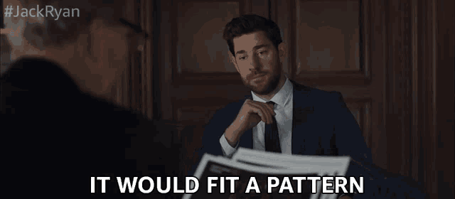 a man in a suit and tie is talking to another man with the words 