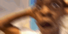a close up of a person 's face with their mouth open