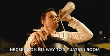 a man in a car drinking from a bottle and smoking a cigarette with the words hegseth on his way to situation room
