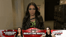 a female wrestler stands in front of a sign that says elimination chamber