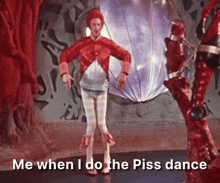 a man in a red outfit is dancing with the words me when i do the piss dance