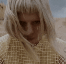 a close up of a woman 's face with a grid pattern
