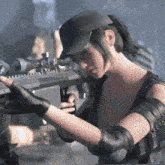 a woman in a hat holds a gun in her hand