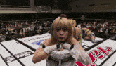 a woman in a boxing ring with a sign that says stardo