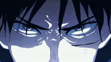a close up of a person 's face with a serious look on his face