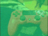 a close up of a video game controller with green buttons