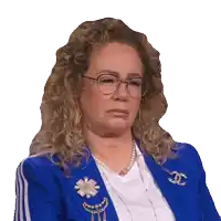 a woman with curly hair wearing glasses and a blue jacket