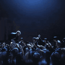 a man is being thrown into the air by a crowd