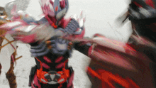 a blurred image of a person in a costume with the letter k on it