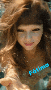 a picture of a woman underwater with the name fatima written on the bottom