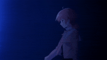 a girl with a ponytail stands in a dark room