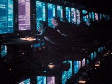 a person is typing on a keyboard with a shadow of their hands behind them