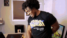 a man wearing a black shirt that says flirting casual