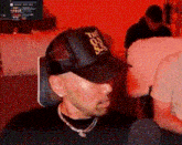 a man wearing a hat that says the on so on it .
