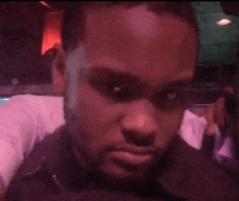 a man with a beard is taking a picture of himself