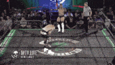 a wrestling ring with the words iwtv live on the bottom right