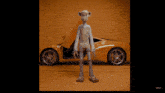 a toy monkey is standing in front of a yellow sports car
