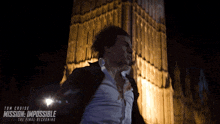 a movie poster for mission impossible the final reckoning shows a man running in front of big ben
