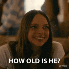 a girl is smiling and asking how old is he on netflix