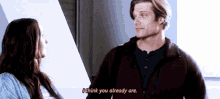 a man and a woman are standing next to each other and the man is saying i think you already are