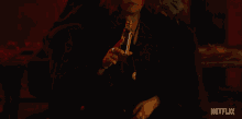 a netflix ad shows a man holding a woman 's hand