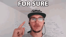 a man wearing glasses and a hat with the word canadian on it says for sure