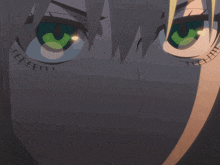 a close up of a cartoon character 's face with green eyes