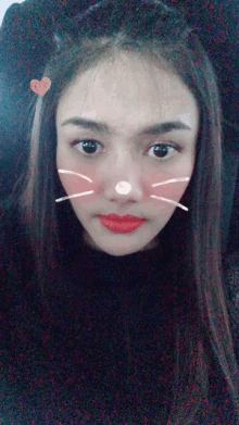 a close up of a woman 's face with a cat ear on her head