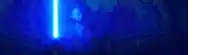 a blue light is shining on a dark background in a dark room .