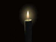 a white candle with a picture of a couple on it