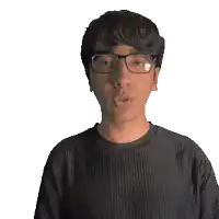 a man wearing glasses and a black shirt that says noel blows a kiss