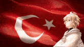a boy stands in front of a red flag with a white star