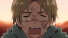 a boy with glasses is crying with a tear coming out of his eye