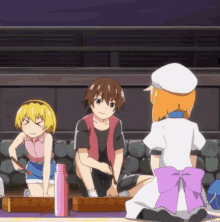 a girl with a purple bow is kneeling next to a boy