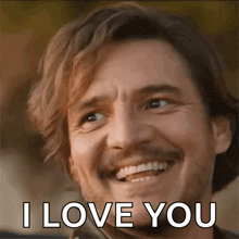 a man is smiling and saying `` i love you '' .