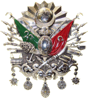 a silver emblem with a red and green flag and a crescent moon