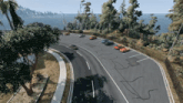 cars are parked on the side of a curvy road