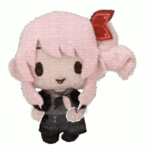 a stuffed animal with a red bow on its head is dancing .