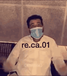 a man wearing a face mask with re.ca.01 written on it