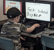 a young boy sits in front of a computer screen that says fuck school buy bip