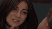 a close up of a woman with her eyes closed