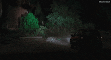 a car is driving down a road at night with illusive soul written on the bottom of the screen