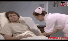 a nurse is putting a bandage on a patient in a hospital bed with the name emma lyons in the corner