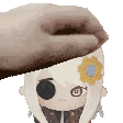 a person is putting a beret on a stuffed animal .