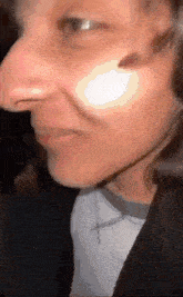 a close up of a person 's face with a large nose