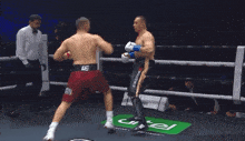 a man in a boxing ring with a belt that says le