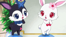 a black bunny and a white bunny with red eyes