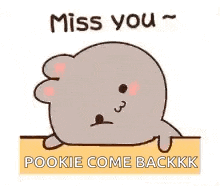 a cartoon rabbit is laying down on a table and saying `` miss you '' .