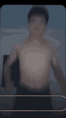 a shirtless man stands next to a baby