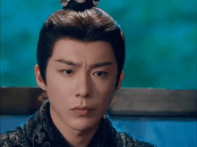 a close up of a man with a crown on his head